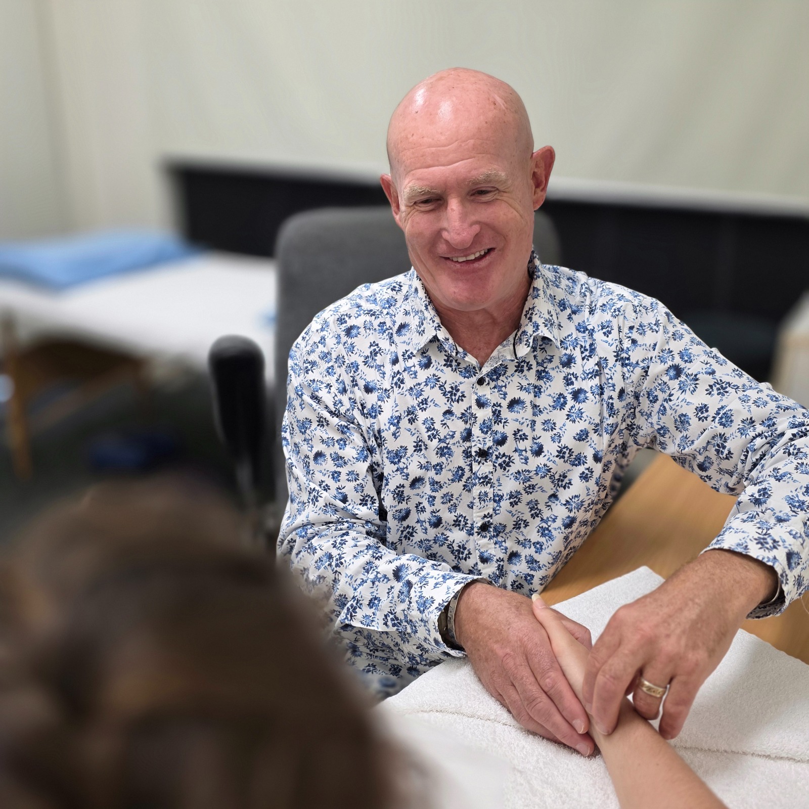 Dr Mal McKay reassuring a patient during a treatment consultation